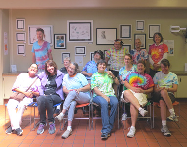 Group photo in front of art show installation