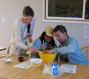 Three people cooking