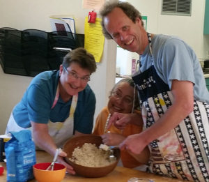 Photo of three people cooking