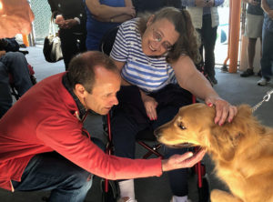photo of participants petting dog